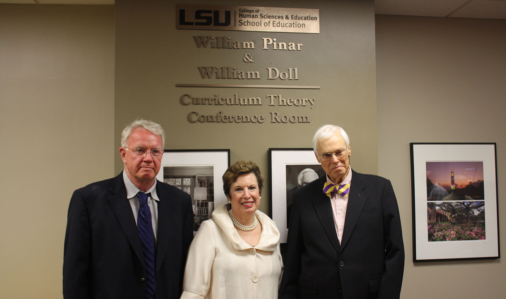 Dean Lindsay, Dr. Pinar and Dr. Doll pose in front of their named  conference room