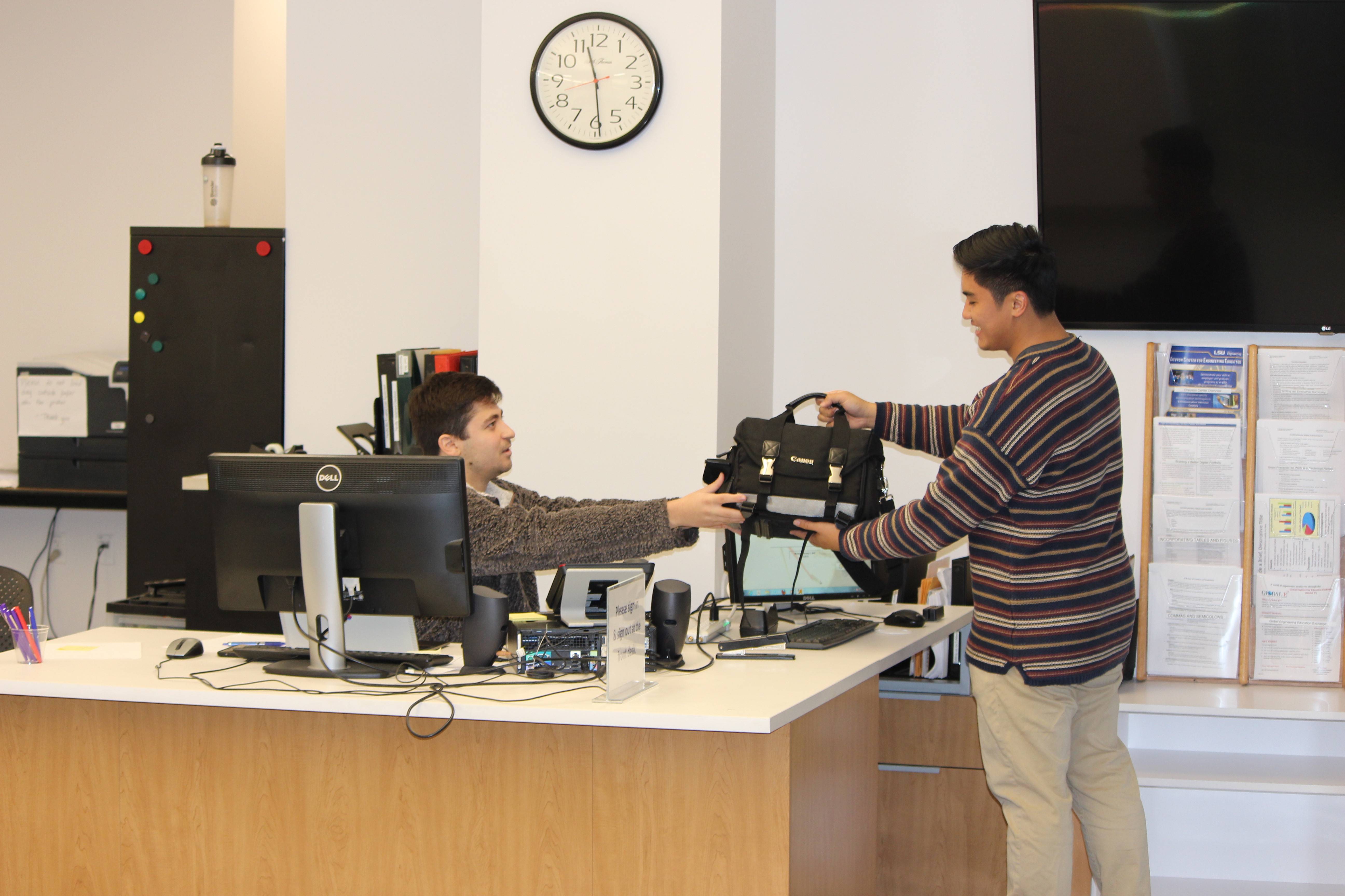 Student checking out a camera