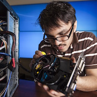 Electrical engineering student works on project.