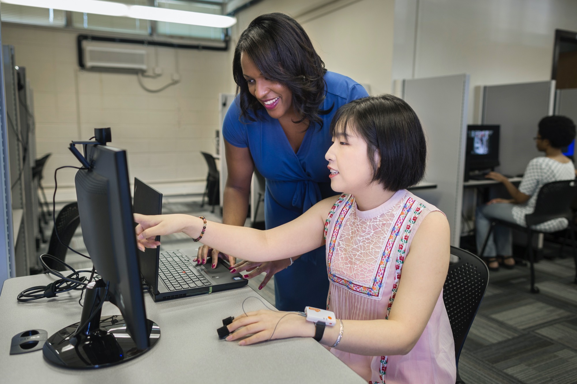 meghan sanders with student in media effects lab